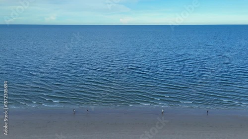 City beach in Southeast Asia with oceanfront resorts