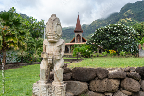 Photography Tiki statue in front of the Vaitahu church, Tahuata, Marquesas Islands, French P