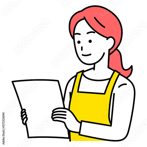 書類を見るエプロン姿の女性