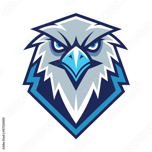 Fierce eagle head with gray feathers and piercing blue eyes stares intensely ahead