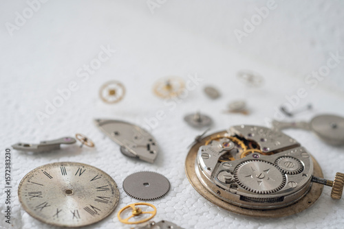 disassembled the clock on a white background
