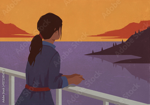 Serene woman looking at scenic sunset lake view from waterfront balcony
