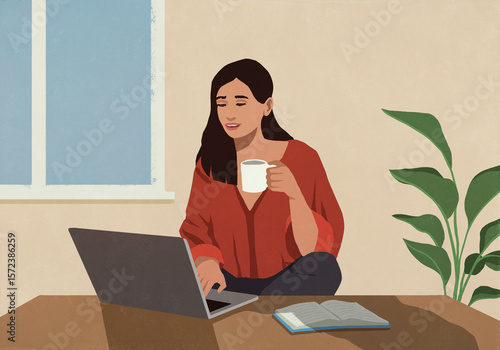 Woman drinking coffee and working at laptop
