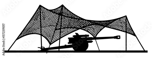 heavy cannon concealed under large camouflage net silhouette