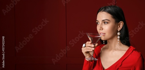 Beautiful young woman drink...