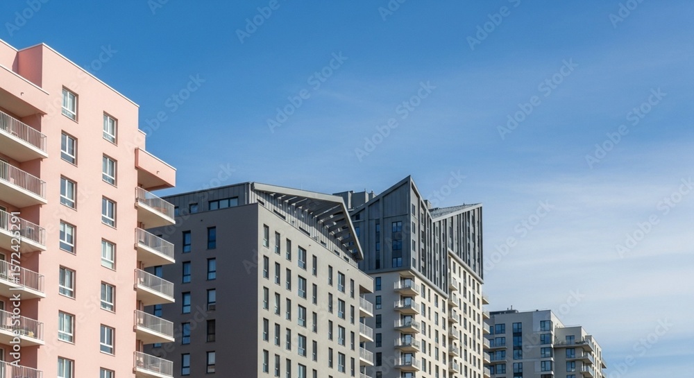 Naklejka premium contemporary residential towers with distinctive facade patterns city development