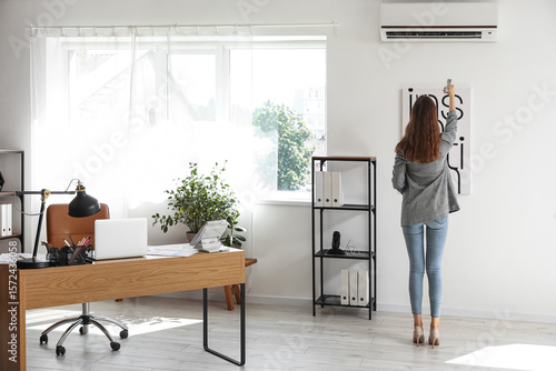 Young businesswoman turning...