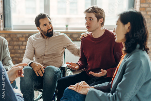 Fotografie Diverse group of multinational people supporting each other during group therapy