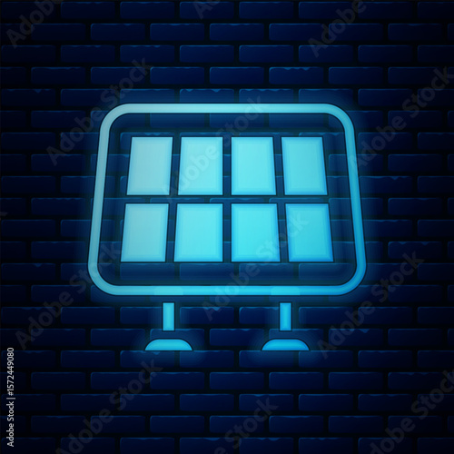 Glowing neon Solar energy panel icon isolated on brick wall background. Vector