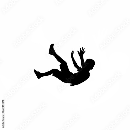 Silhouette of boy falling sideways with arms reaching out on white background