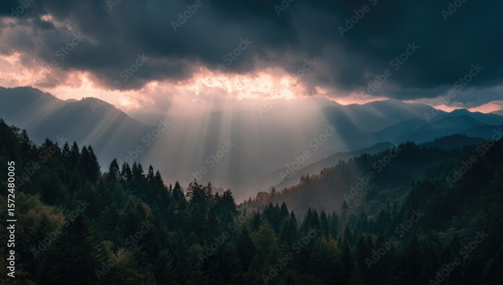 Fototapeta premium Mountain vista, sunbeams piercing dark clouds