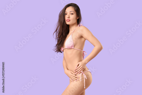 Young asian woman in pink b...