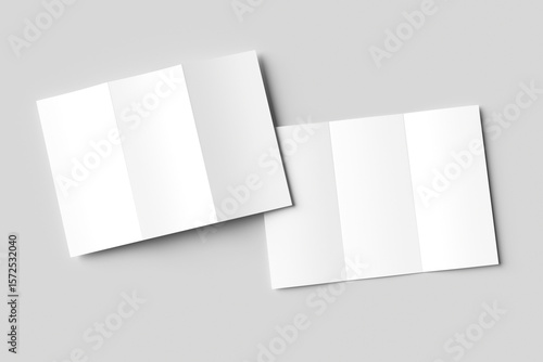 Two blank white tri-fold brochure mockups, slightly overlapping on a light gray background. One is partially open, the other closed. Ideal for clean design presentations
