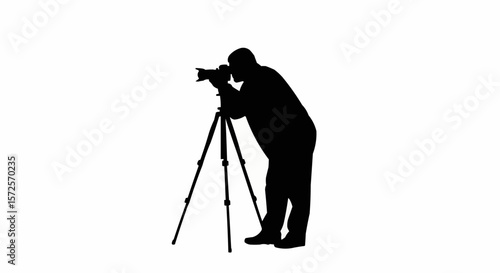 Silhouette of Photographer with Tripod Taking Photos on White Background