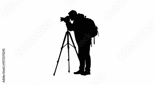 Silhouette of Photographer with Tripod Taking Photos on White Background