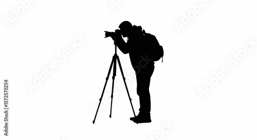 Silhouette of Photographer with Tripod Taking Photos on White Background