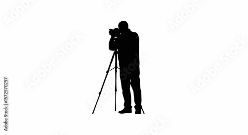 Silhouette of Photographer with Tripod Taking Photos on White Background