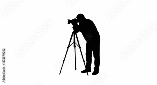 Silhouette of Photographer with Tripod Taking Photos on White Background