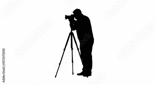 Silhouette of Photographer with Tripod Taking Photos on White Background