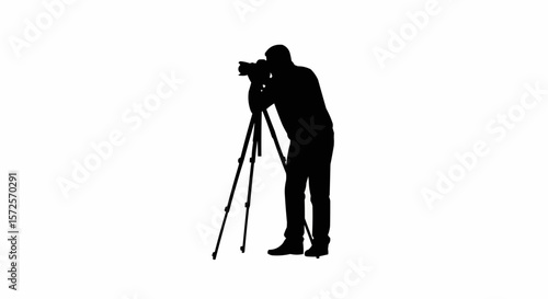 Silhouette of Photographer with Tripod Taking Photos on White Background