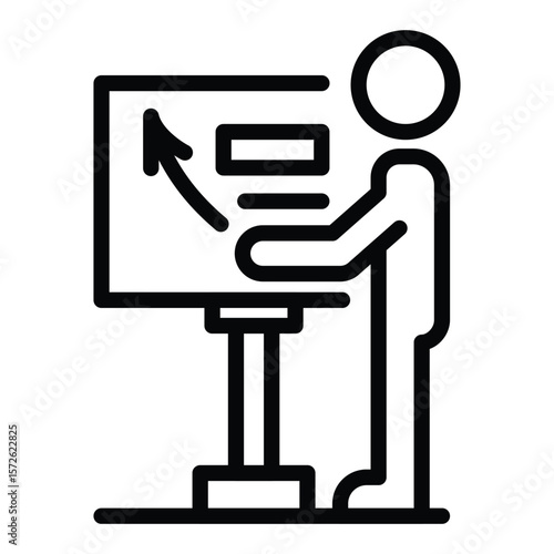 A person stands by a board showing an arrow and text