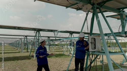 Wallpaper Mural Engineers are working at solar farm. Electricity, sustainability. Torontodigital.ca