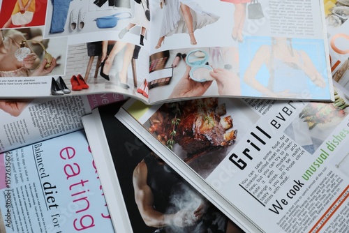 Many different trendy magazines as background, closeup