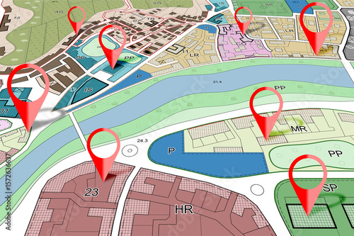 Real Estate and Building Activity concept with red location pin point against an imaginary General Urban Plan with zoning regulations, urban districts, urban destinations and land use
