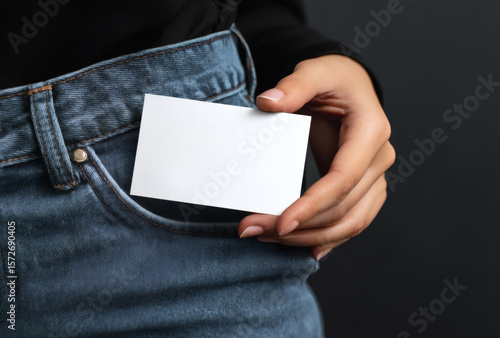 Mockup of Hand Holding Blank Business Card in Jeans Pocket