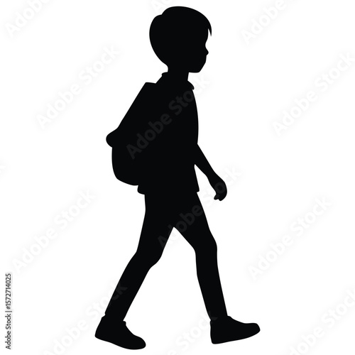 Silhouette of a schoolboy walking side view with backpack