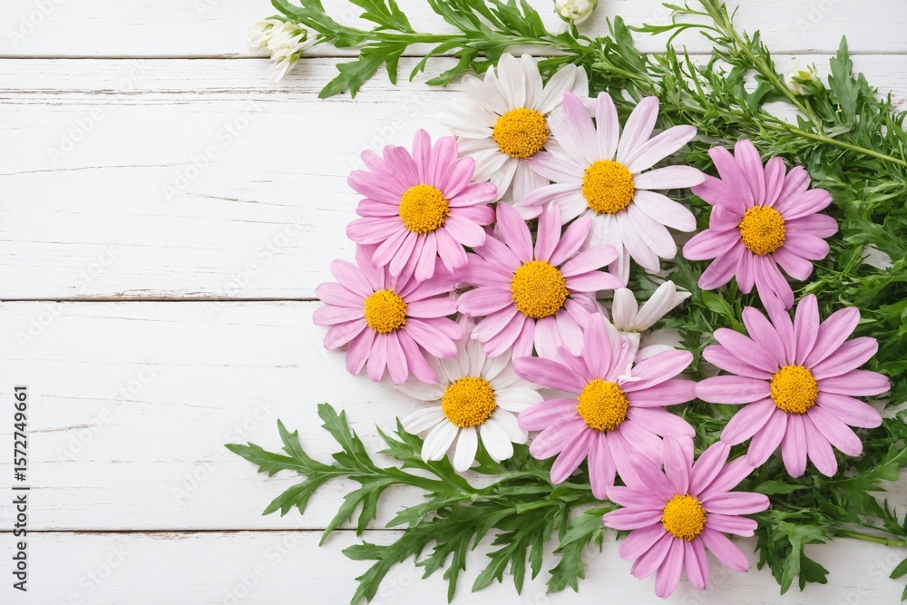 Fototapeta premium Flowers daisies chamomiles flat lay on wooden background with copy space