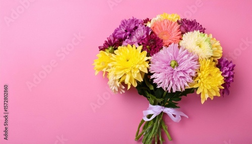  A bouquet of flowers on a pink background. Bouquet of multicolored flowers 