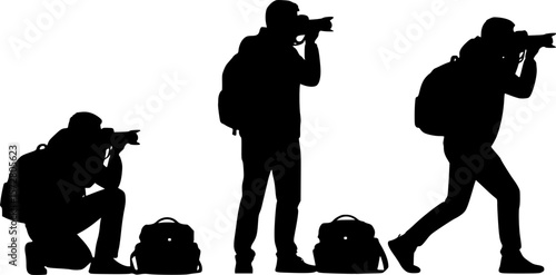 Silhouettes of photographers in various poses taking pictures with cameras in a black and white image 