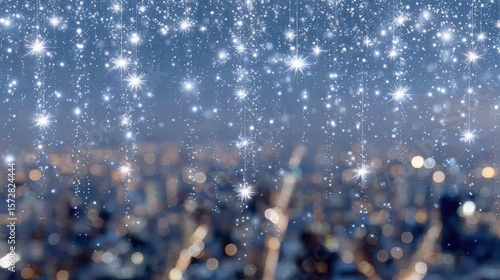 Snowflakes gently falling over a city skyline during a calm winter day with soft gray skies.