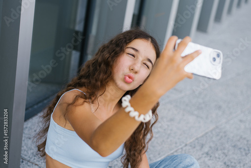Teen Girl Taking A Selfie Outdoors