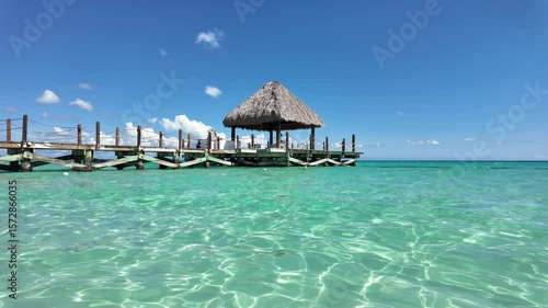 Bayahibe Beach and Wooden Pier Over Crystal Clear Caribbean Sea