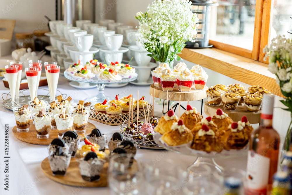 Fototapeta premium Dessert buffet or candy bar during catering event, fruits and whipped cream