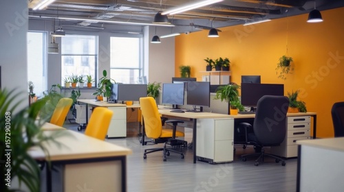 Vibrant co-working space featuring modern design with desks, chairs, and plants