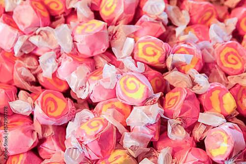 Close-up of pink and yellow taffy candies