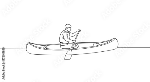Canoeist paddling on calm water