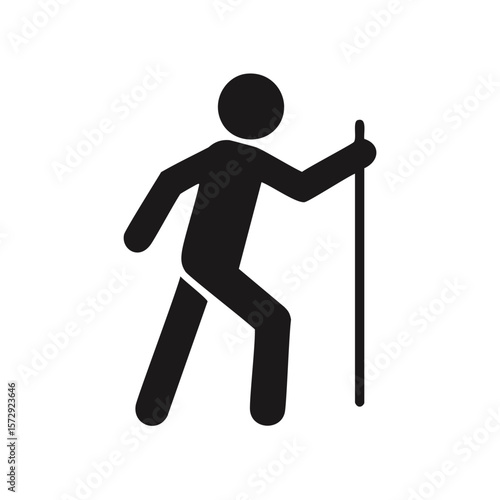 Black silhouette of a person hiking with a pole trekking walking