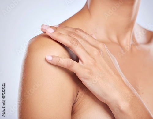 Wallpaper Mural Woman's hand on bare shoulder, showcasing smooth, healthy skin, body care, and tactile comfort. Torontodigital.ca