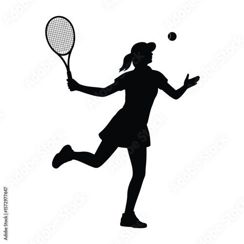 Silhouette of a female tennis player tossing a ball before a serve