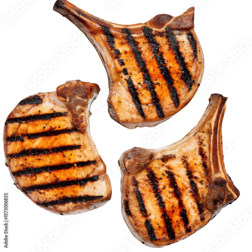 Three grilled pork chops with grill marks arranged on a transparent background isolated on transparent background