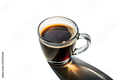 A clear glass cup of hot black coffee casts a long shadow on a bright morning isolated on transparent background