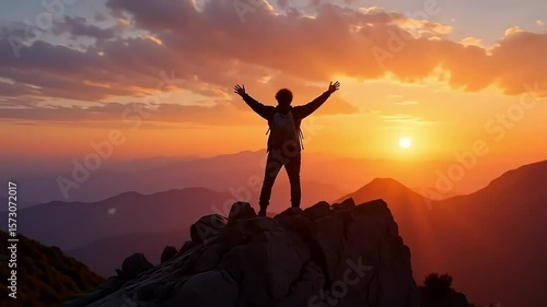 Man celebrating success on mountain top at sunset achievement goal accomplishment travel adventure 100