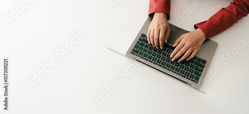 Close-up portrait typing keyboard on laptop computer. Working online on white table at office. Facebook chat. Website meeting. Blogger. Journalist writing articles. online job ideas