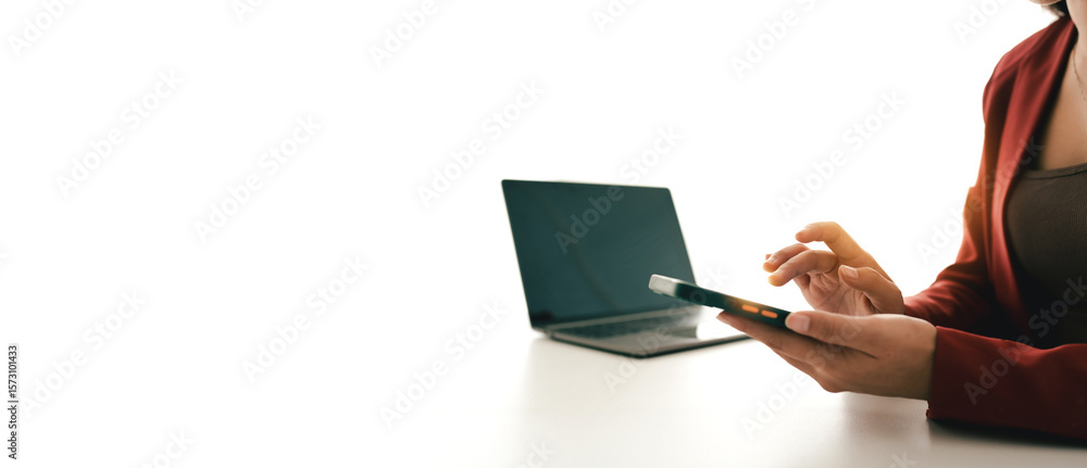 Fototapeta premium Portrait of a young woman holding a mobile phone to use social media on a smartphone. Communicate via the Internet on a smartphone. concept of using technology in communication