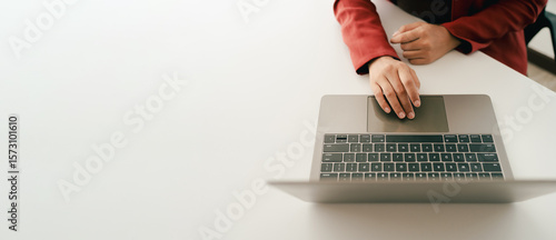 Close-up portrait typing keyboard on laptop computer. Working online on white table at office. Facebook chat. Website meeting. Blogger. Journalist writing articles. online job ideas
