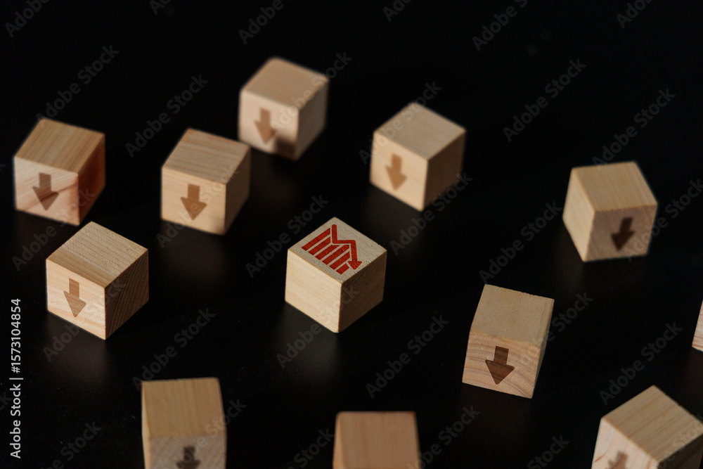 Fototapeta premium Market Downturn and Declining Graph Arrow Wooden Blocks